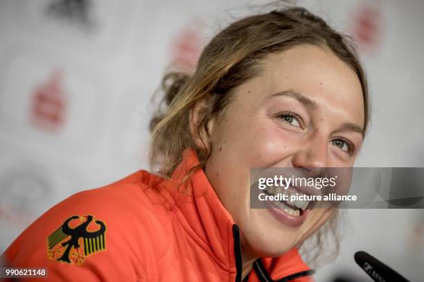 German biathlete Laura Dahlmeier smiles at a press conference of the German Olympics Sports Association in the German House in Pyeongchang, South...