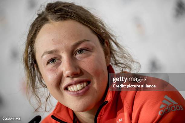 German biathlete Laura Dahlmeier smiles at a press conference of the German Olympics Sports Association in the German House in Pyeongchang, South...