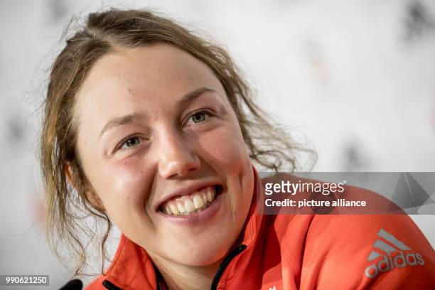 German biathlete Laura Dahlmeier smiles at a press conference of the German Olympics Sports Association in the German House in Pyeongchang, South...