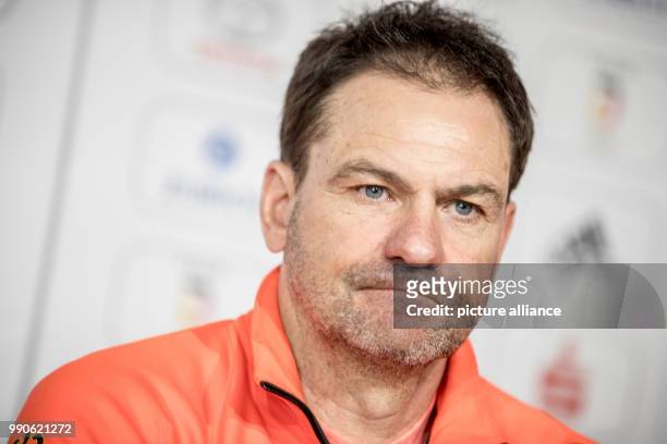 German nordic combined coach Hermann Weinbuch answers questions at a press conference of the German Olympics Sports Association in the German House...