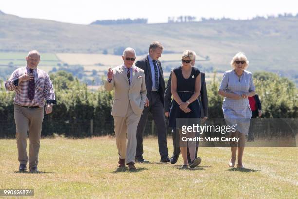 Camilla, the Duchess of Cornwall, and Prince Charles, Prince of Wales visits Dyfed Shire Horse Farm in Eglwyswrw on July 3, 2018 in Pembrokeshire,...