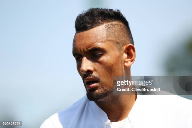 Nick Kyrgios of Australia looks on during his Men's Singles first round match against Denis Istomin of Uzbekistan on day two of the Wimbledon Lawn...