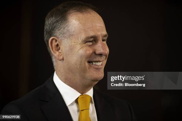 Tony Douglas, chief executive officer of Etihad Airways, reacts while speaking during a Bloomberg Television interview at the Etihad Group...