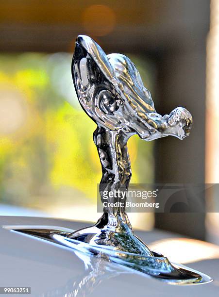 The "Spirit of Ecstacy" hood ornament mounted on a 2010 Rolls Royce Ghost is displayed for a photograph in Philadelphia, Pennsylvania, U.S., on...