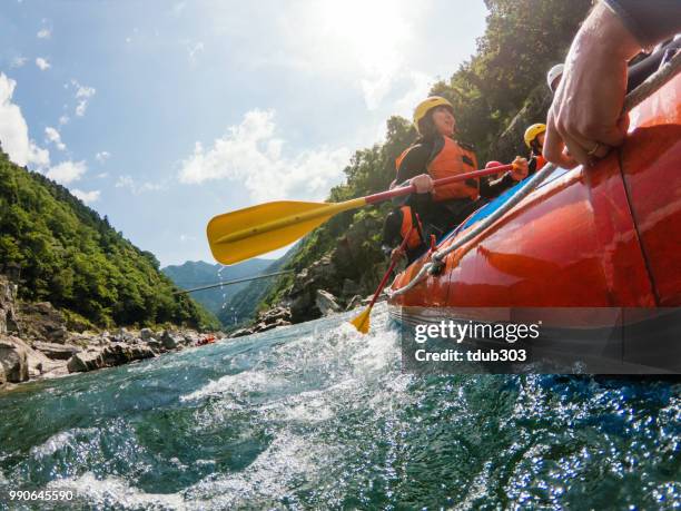 low angle view of a white water river rafting excursion - white water rafting stock pictures, royalty-free photos & images
