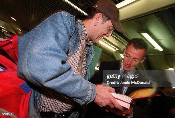 Rob Howley signs an autograph at Heathrow Airport prior to his departure on the British Lions tour of Australia. Mandatory Credit: Jamie...