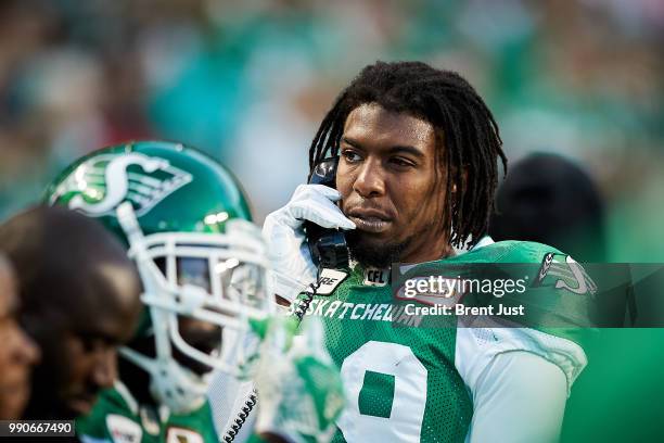 Duron Carter of the Saskatchewan Roughriders on the sideline phone with the coaches during the game between the Montreal Alouettes and Saskatchewan...