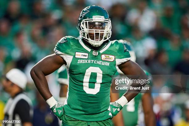 Tobi Antigha of the Saskatchewan Roughriders looks to the sideline for the play call during the game between the Montreal Alouettes and Saskatchewan...