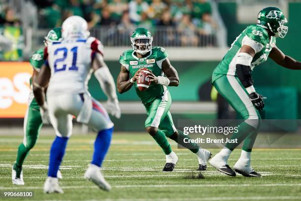 David Watford of the Saskatchewan Roughriders looks for an open receiver in the game between the Montreal Alouettes and Saskatchewan Roughriders at...