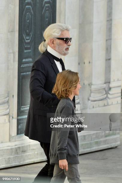 Fashion designer Karl Lagerfeld and Hudson Kroenig walk the runway during the Chanel Haute Couture Fall Winter 2018/2019 show as part of Paris...
