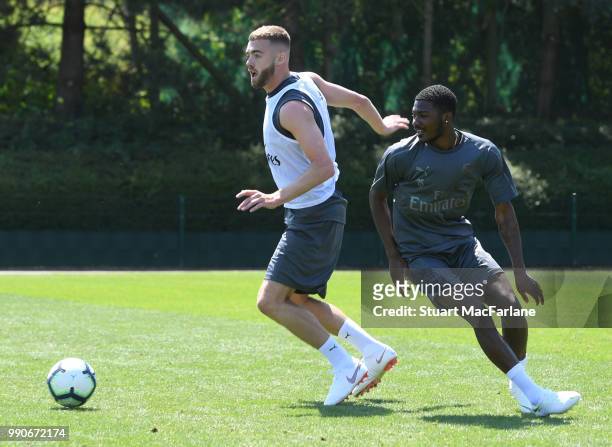 Calum Chambers and Ainsley Maitland-Niles of Arsenal during a training session at London Colney on July 3, 2018 in St Albans, England.