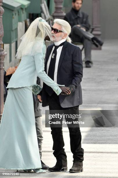 Model Adut Akech and Fashion designer Karl Lagerfeld kiss on the runway during the Chanel Haute Couture Fall Winter 2018/2019 show as part of Paris...