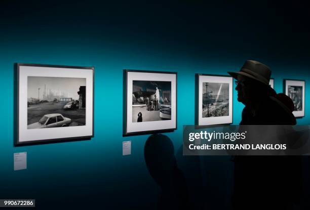 People visit the exhibition "Depardon USA, 1968-1999" by French photographer Raymond Depardon as part of the photography festival "Les Rencontres de...