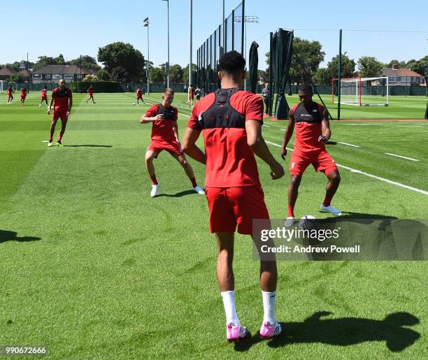 Ben Woodburn and Daniel Sturridge of Liverpool during a training session on the second day back at Melwood Training Ground for the pre-season...