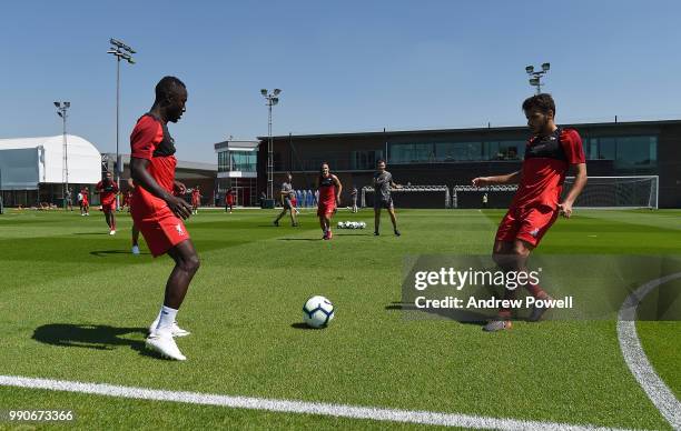 Naby Keita and Pedro Chirivella of Liverpool during a training session on the second day back at Melwood Training Ground for the pre-season training...
