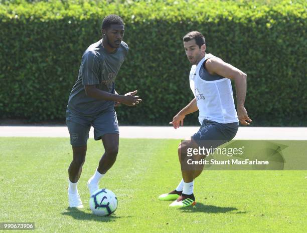 Ainsley Maitland-Niles and Henrikh Mkhitaryan of Arsenal during a training session at London Colney on July 3, 2018 in St Albans, England.
