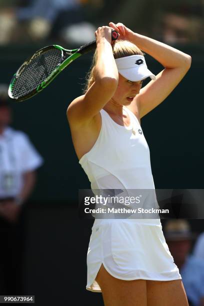 Naomi Broady of Great Britain reacts against Garbine Muguruza of Spain during their Ladies' Singles first round match on day two of the Wimbledon...