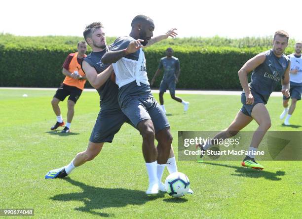 Carl Jenkinson and Alex Lacazette of Arsenal during a training session at London Colney on July 3, 2018 in St Albans, England.