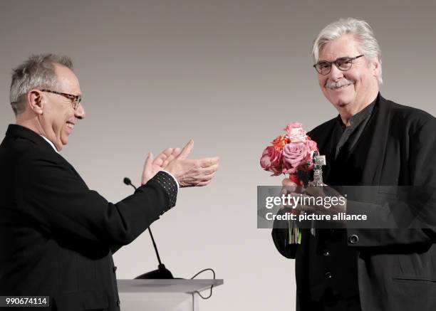 Febuary 2018, Germany, Berlin: Berlinale, Berlinale Kamera for Jiri Menzel: Dieter Kosslick , the director of the Berlinale, applauds after handing...