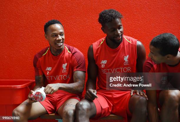 Nathaniel Clyne and Divock Origi of Liverpool getting their boots on before a training session on the second day back at Melwood Training Ground for...