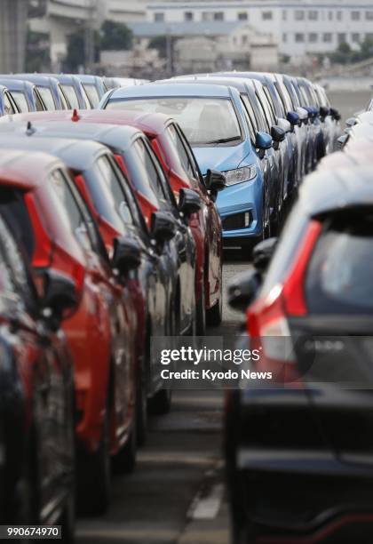 Photo taken on May 24 shows cars awaiting exportation at Yokohama Port's Daikoku Pier, near Tokyo. ==Kyodo