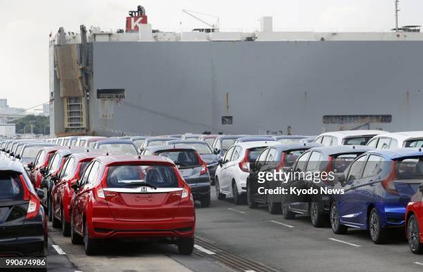 Photo taken on May 24 shows cars awaiting exportation at Yokohama Port's Daikoku Pier, near Tokyo. ==Kyodo