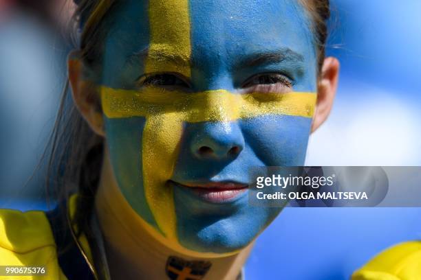 Sweden fan waits for the start of the Russia 2018 World Cup round of 16 football match between Sweden and Switzerland at the Saint Petersburg Stadium...