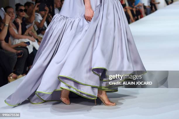 Model presents a creation by Alexis Mabille during the 2018-2019 Fall/Winter Haute Couture collection fashion show in Paris, on July 3, 2018.