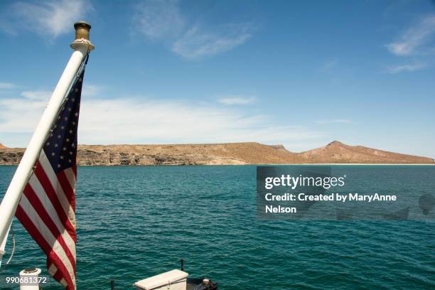 american flag on boat in sea of cortez - sea of cortez foto e immagini stock