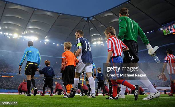 Danny Murphy and Mark Schwarzer of Fulham enter the pitch ahead of the UEFA Europa League final match between Atletico Madrid and Fulham at HSH...