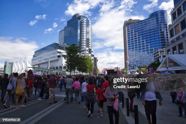 crowd at canada place on canada day, vancouver, canada - the blue man group in vancouver stock pictures, royalty-free photos & images