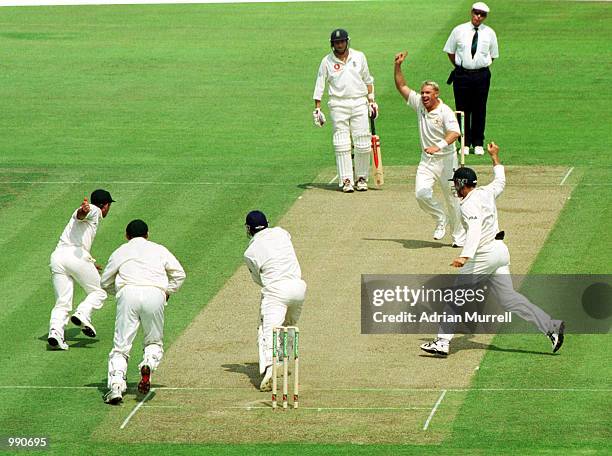 Shane Warne of Australia celebrates taking the wicket of Mark Butcher caught by Ricky Ponting for 38 runs during the opening day of the npower first...