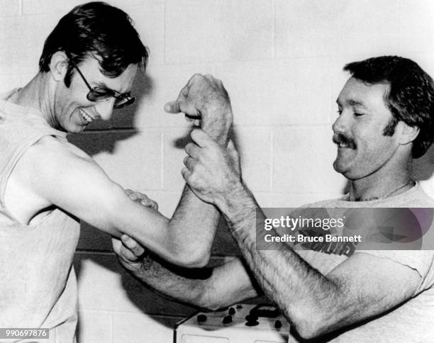 Pitcher Jim Rooker of the Pittsburgh Pirates checks the arm of teammate Kent Tekulve before Game 5 of the 1979 World Series against the Baltimore...