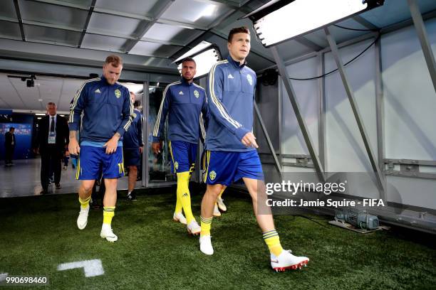 John Guidetti, Isaac Kiese Thelin and Mikael Lustig of Sweden walk on the pitch for warm up prior to the 2018 FIFA World Cup Russia Round of 16 match...
