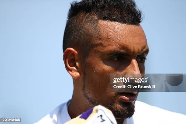 Nick Kyrgios of Australia looks on during his Men's Singles first round match against Denis Istomin of Uzbekistan on day two of the Wimbledon Lawn...