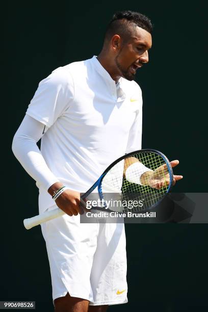 Nick Kyrgios of Australia reacts during his Men's Singles first round match against Denis Istomin of Uzbekistan on day two of the Wimbledon Lawn...