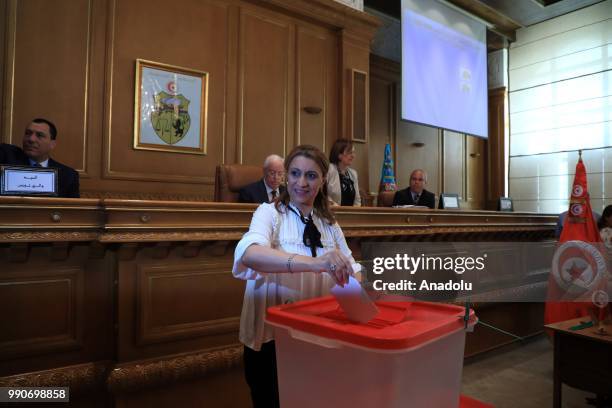 Ennahda party candidate Souad Abderrahim casts her vote for the municipal election of Tunis during the Tunis Municipal Council meeting in Tunis,...