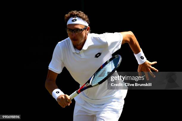 Denis Istomin of Uzbekistan during his Men's Singles first round match against Nick Kyrgios of Australia on day two of the Wimbledon Lawn Tennis...