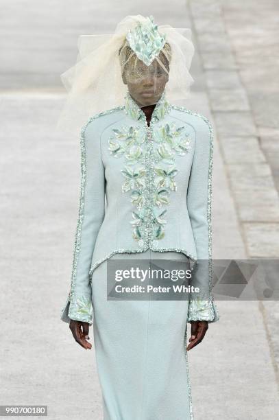 Adut Akech walks the runway during the Chanel Haute Couture Fall Winter 2018/2019 show as part of Paris Fashion Week on July 3, 2018 in Paris, France.