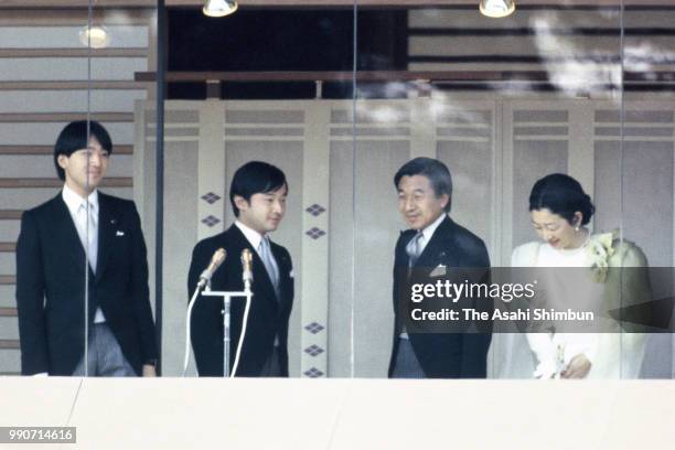 Prince Fumihito, Prince Naruhito, Crown Prince Akihito and Crown Princess Michiko are seen from a balcony at a New Year celebration at the Imperial...