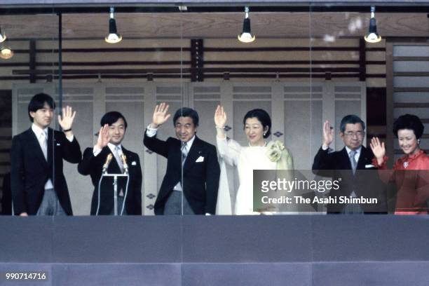 Prince Fumihito, Prince Naruhito, Crown Prince Akihito, Crown Princess Michiko, Prince Hitachi and Princess Hanako of Hitachi wave to well-wishers...