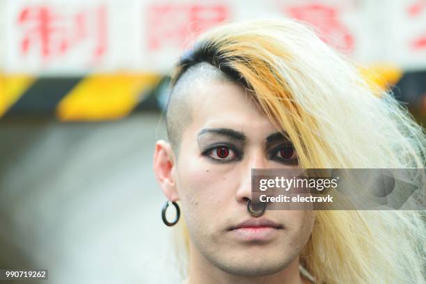 portrait of cool-looking young man - emo eye makeup stock pictures, royalty-free photos & images