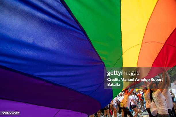 Demostrators display a big LGBT flag during the San Jose's Gay Pride Parade on July 01, 2018 in San Jose, Costa Rica.