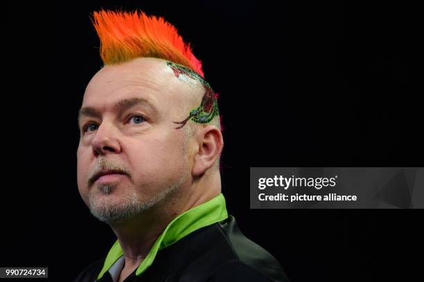 February 2018, Germany, Berlin: Darts: Premier League, 4th match day at Mercedes-Benz-Arena. Dart player Peter Wright from England reacts. Photo:...