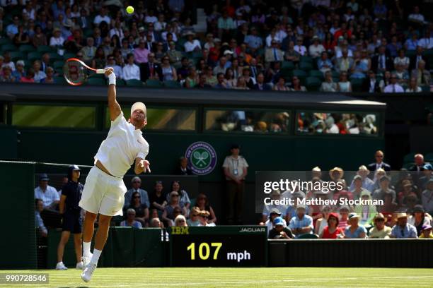 Dudi Sela of Isreal serves against Rafael Nadal of Spain during his Men's Singles first round match against on day two of the Wimbledon Lawn Tennis...