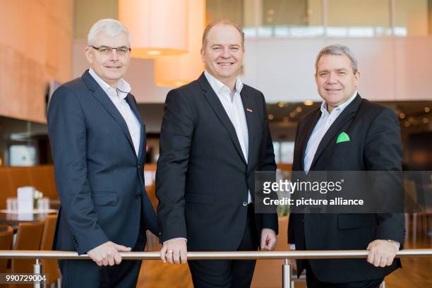 February 2018, Germany, Duesseldorf: Board members of electonics retailer ElektronicPartner, Karl Trautmann , Frank Kretzschmar and Friedrich Sobol,...