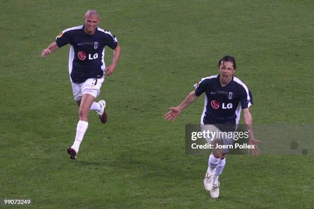 Simon Davies of Fulham celebrates with team mate Paul Konchesky after scoring his team's first goal during the UEFA Europa League final match between...