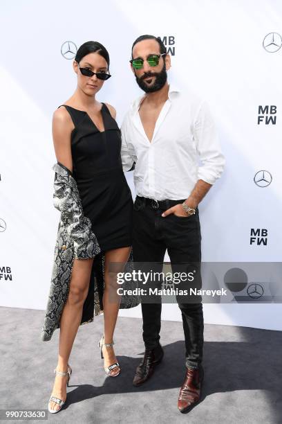 Rebecca Mir and husband Massimo Sinato attend the Lena Hoschek show during the Berlin Fashion Week Spring/Summer 2019 at ewerk on July 3, 2018 in...