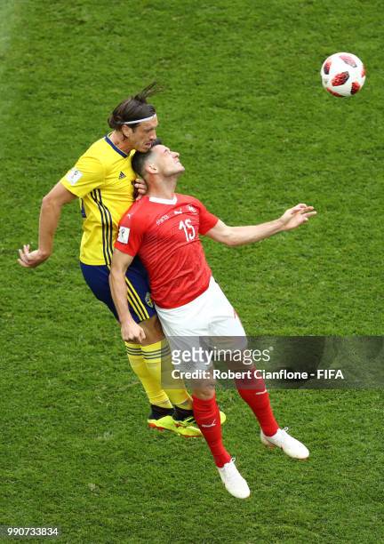 Gustav Svensson of Sweden wins a header over Blerim Dzemaili of Switzerland during the 2018 FIFA World Cup Russia Round of 16 match between Sweden...