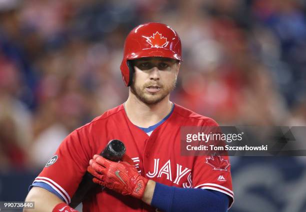 Justin Smoak of the Toronto Blue Jays during his at bat in the sixth inning as the team wears red jerseys on Canada Day during MLB game action...